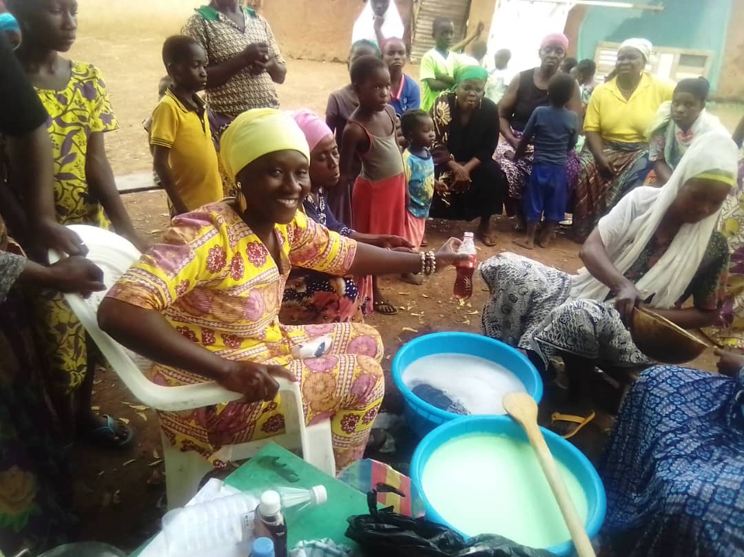 Women learning shea butter processing